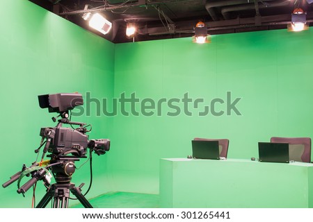Television studio with camera and lights - camera on tripod