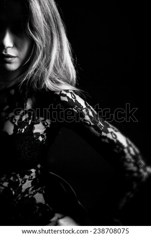 Portrait of a Girl in a Lace Dress on a Black Background, Black and White Photography. Photo, Picture