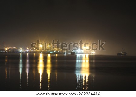 Port lights with reflection in darkness