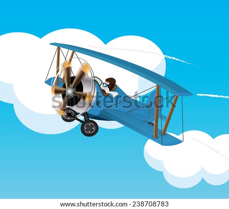 Sky blue bi plane behind a blue sky. A vintage blue bi-plane aircraft with rotating propellers in front of a blue sky and clouds.