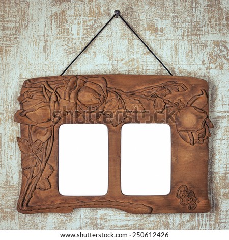 Old wooden picture frame hanging on the wall