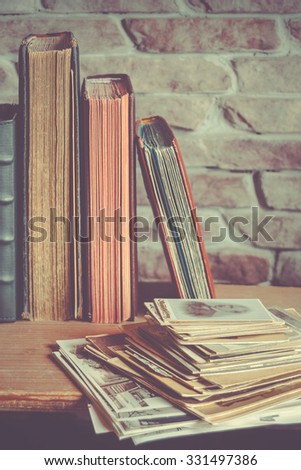 Old family photo albums  and a stack of photos