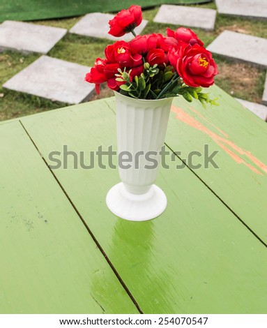 vase with red flower
