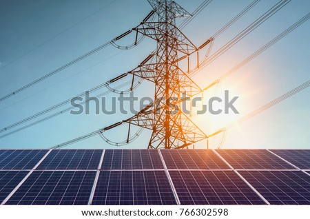 Solar panels with  electricity pylon and sunset. Clean power energy concept