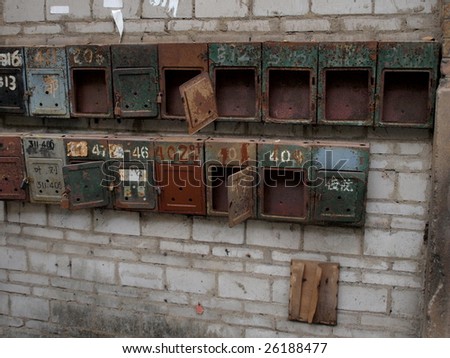 Old mail boxes in China.There are for different family in this building.