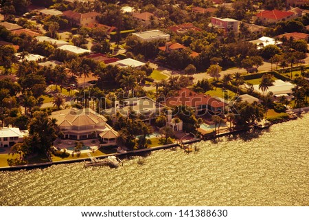 An aerial view of prime real estate in Miami, Florida on a golden sunny afternoon.
