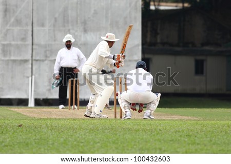 KUALA LUMPUR, MALAYSIA - MARCH 3:Unidentified batsman prepare to hit the ball during a friendly match between Royal Selangor Club and Silver State Cricket Club on March 3,1012 in Kuala Lumpur,Malaysia