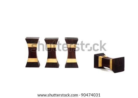 A set of four wood stud with one of it fell down
