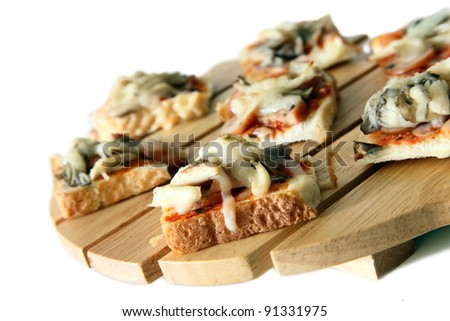 stock photo : Homemade healthy cutie pizza bread on top of wooden cutting board on white