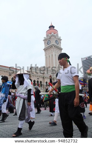 KUALA LUMPUR - JAN 28 : Malaysian cosplay group members with their character costumes participate during the Federal Territory Day celebration parade on Jan 28,2012 in Kuala Lumpur,Malaysia