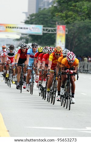 PUTRAJAYA, MALAYSIA - FEB 18 : Members of the Malaysian cyclist team lead the main peloton in 180km Road Race Men Elite during the 32nd Asian & 19th Junior Asian Cycling Championship on Feb 18, 2012 in Putrajaya, Malaysia