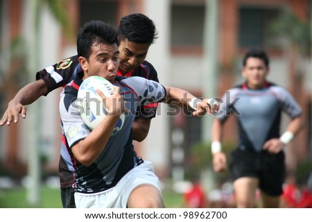 KUALA LUMPUR-MARCH 31:Unidentified UiTM Lions players run towards touchline during a Malaysian Rugby Union(MRU) Super League 2012 match (UiTM Lions vs SAHOCA) on March 31,2012 in Kuala Lumpur,Malaysia