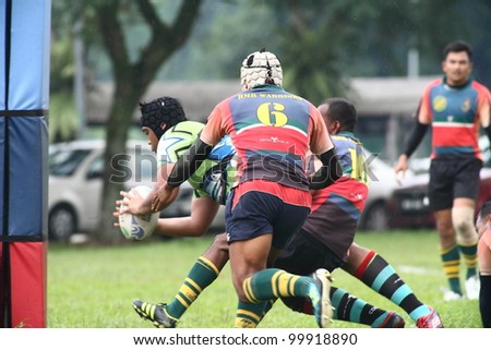 KUALA LUMPUR-APRIL 8:Unidentified Keris Conlay player attempt a try during a Malaysian Rugby Union (MRU) Super League match against ATM RAMD on April 8,2012 in Kuala Lumpur, Malaysia. Conlay won 29-12