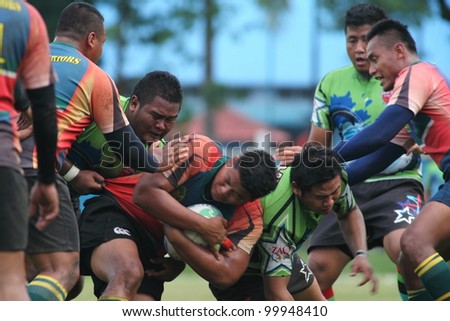 KUALA LUMPUR-APRIL 8:ATM RAMD players defend the ball possession during a Malaysian Rugby Union(MRU) Super League match against Keris Conlay on April 8,2012 in Kuala Lumpur, Malaysia. Conlay won 29-12