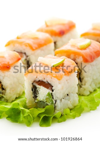 Fish Maki Sushi - Roll with Salmon, Eel and Avocado inside. Topped with Smoked Salmon and Lime