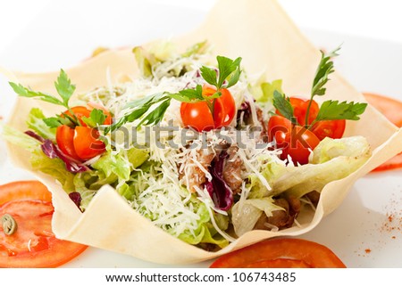 Caesar Salad with Sliced Meat, Salad Leaf, Cherry Tomato and Parmesan Cheese. Garnished with Tomato Slice and Pastry