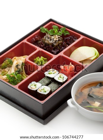 Japanese Meal in a Box (Bento) - Salad, Noodles and Cucumber Sushi Roll, Apple Slice