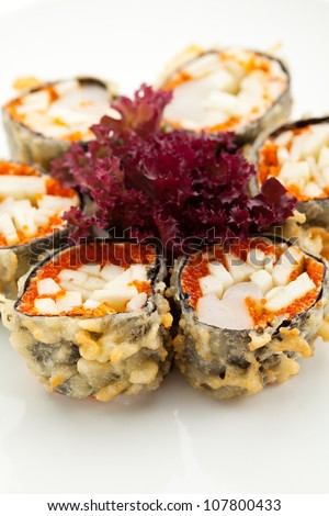 Japanese Cuisine - Deep-fried Sushi Roll with Scallop and Apple Slice, Flying Fish Roe inside. Served with Salad Leaf