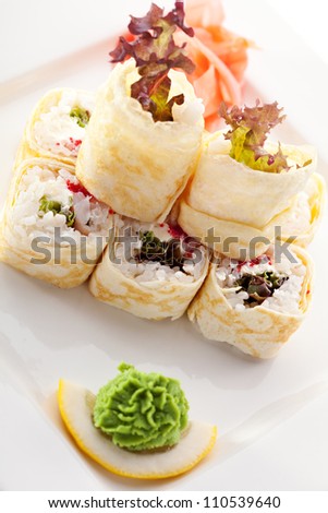Maki Sushi - Roll made of Salad Leaf, Tobiko and Cream Cheese inside. Pancake outside
