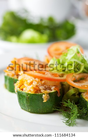 Vegetarian Cereal Food - Stuffed Zucchini Roll with Buckwheat Tomatoes and Salad Leaf