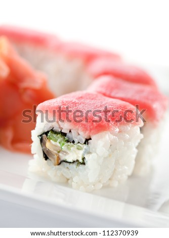 Maki Sushi - Roll with Cucumber and Cream Cheese inside. Topped with Tuna