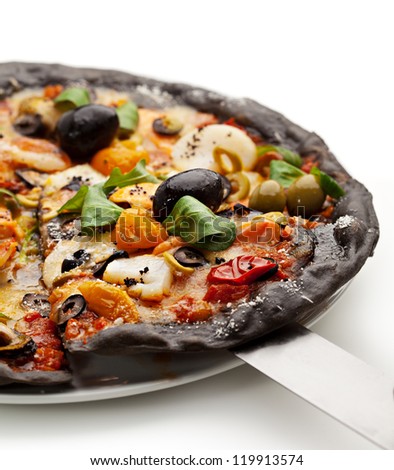 Black Ink Dough Pizza with Seafood, Black and Green Olives, Dried Tomato and Salad Leaves