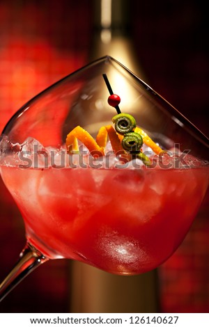 Red Cocktail with Vodka, Orange Juice, Berries and Liquor