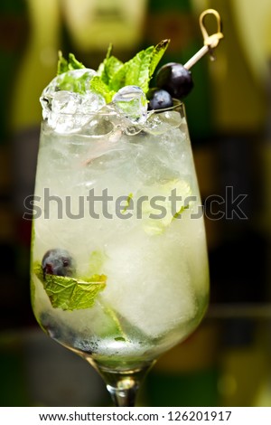 Cocktail with Vodka and White Wine, Grapes, Various Syrup, Lime Juice, Apple Juice and Mint