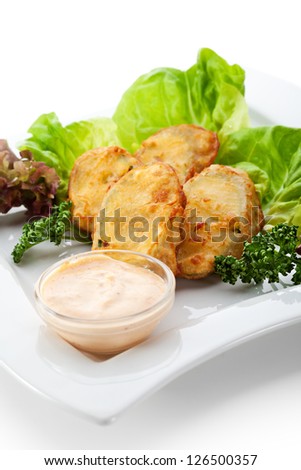 Deep Fried Stuffed Zucchini with Meat. Garnished with Salad Leaf and White Sauce