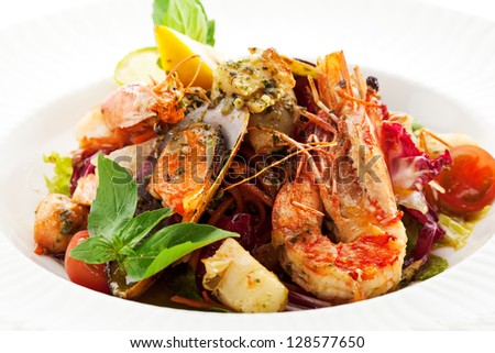 Various Seafood Salad with Basil Leaf and Cherry Tomato