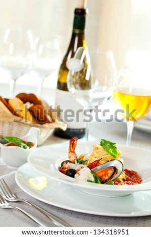 Seafood Spaghetti With Tiger Prawns, Scallops, Mussels, Calamari, Salmon And Tomato Sauce