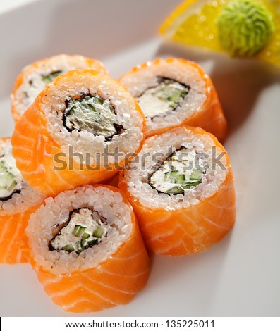 American Maki Sushi - Philadelphia Roll made of Fresh Raw Salmon, Cream Cheese and Cucumber