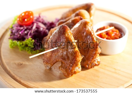 Hot Meat Dishes - Smoked Chicken Wings with Salad Leaves