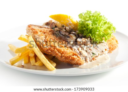 Vienna Schnitzel Served with Mushroom Sauce and French Fries