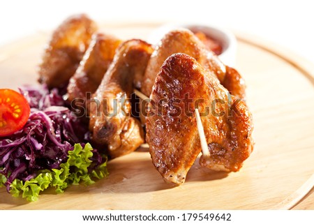 Hot Meat Dishes - Smoked Chicken Wings with Salad Leaves