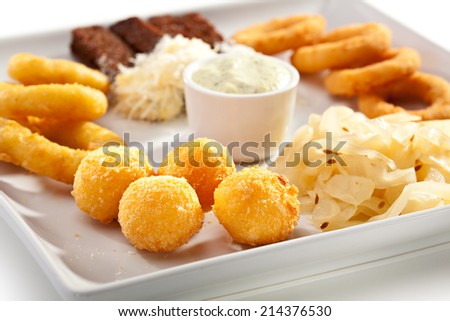 Beef Plate - Garlic Toasts with Parmesan Cheese, Cheese Balls and Calamari Rings. Garnished with Tartar Sauce