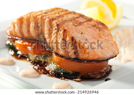 Salmon Steak with Baked Vegetables, White Sauce and Lemon