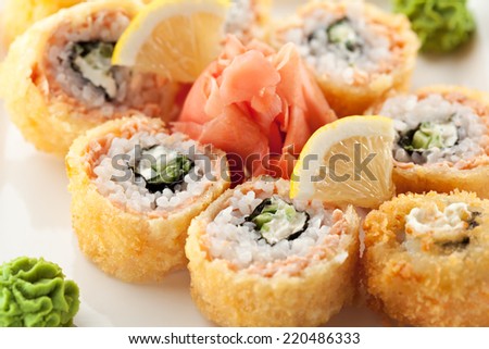 Salmon Fried Maki Sushi - Hot Roll with Cream Cheese and Cucumber inside. Deep Fried Salmon outside.