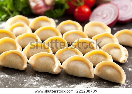 Raw Dumplings on Stone Tray