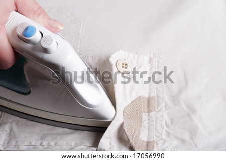 Smoothing Iron, Hand and Clothes Isolated over White