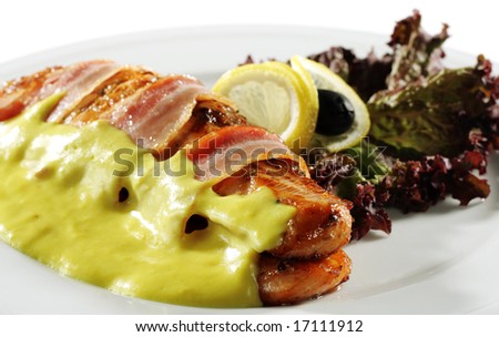 Salmon Steak in Bacon with Lemon Sauce. Isolated on White Background