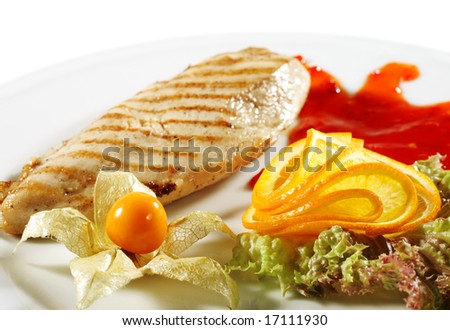 Chicken Grilled Steak with Sauce and Orange Slice. Isolated on White Background