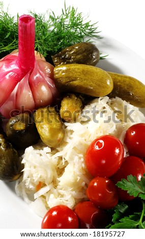 Pickled Vegetables Plate (tomatoes, cucumbers...) Served with Dill and Parsley. Isolated on White Background