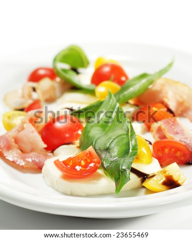 Salad with Cherry Tomato, Buffalo Cheese, Bacon and Vegetable Leaf. Isolated on White Background