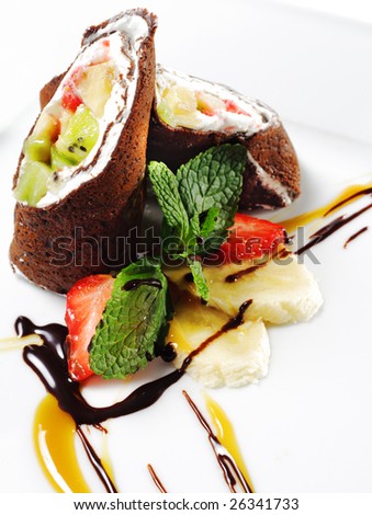 Chocolate Pancakes with Fruit Wrap. Served with Chocolate and Caramel Sauce