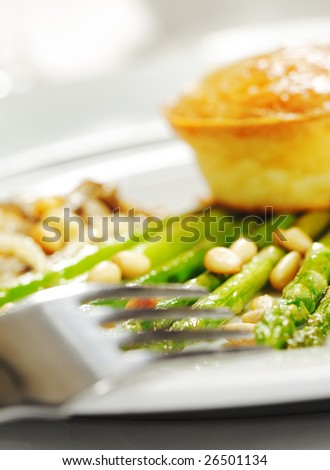 Fork and Fresh Asparagus with Cake. Selective Focus