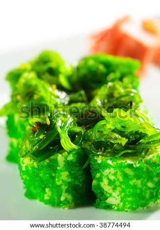 Japanese Cuisine - Fresh Maki Sushi with Green Caviar Tobiko and Seaweed Chuka