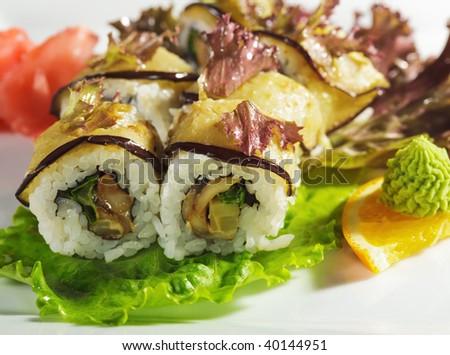 Autumn Roll - Mushrooms and Green Salad inside. Eggplant outside. Topped with Red Salad Leaf