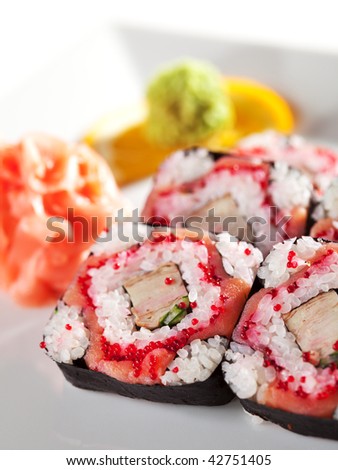 Roll with Smoked Salmon, Tamago (japanese omelet), Tobiko (flying fish roe) and Cucumber inside