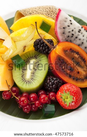 Exotic Fruit Dish with Mint Jelly. Dragon Fruit, Maracuya, Starfruit, Cantaloupe and Berries
